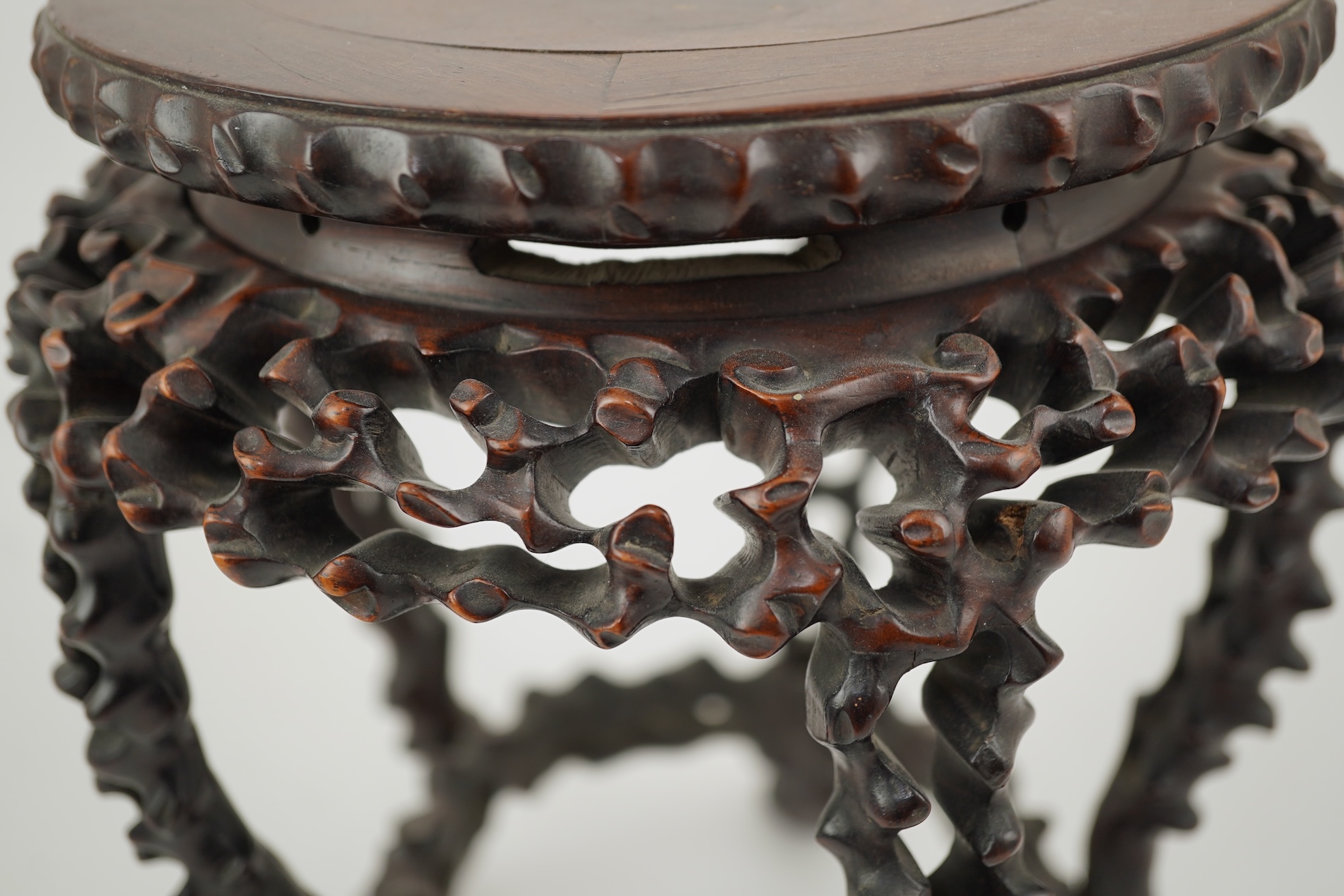 A Chinese hardwood scholar’s stand, carved in imitation of rootwood, early 20th century